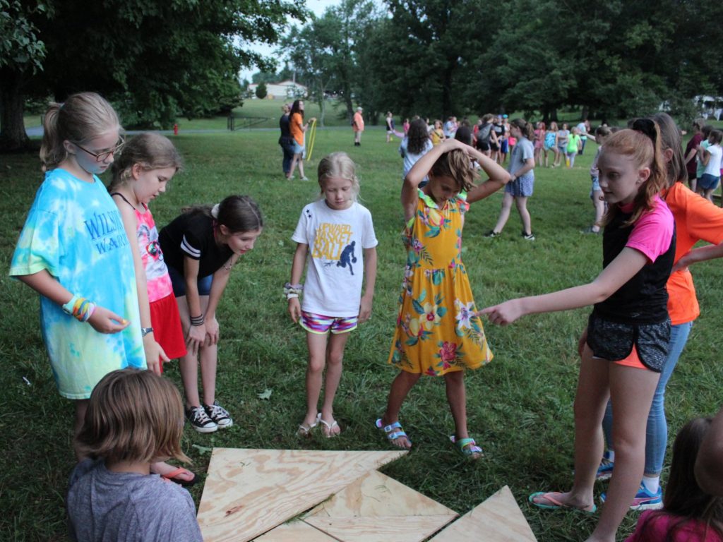 Campers working together on a project